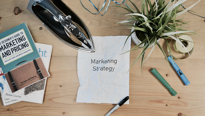 Marketing Strategy written on a piece of paper placed on a table